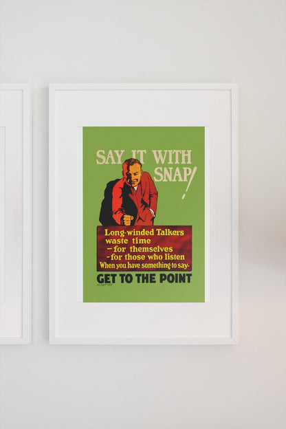 Say It With Snap poster in a white frame on a light wall