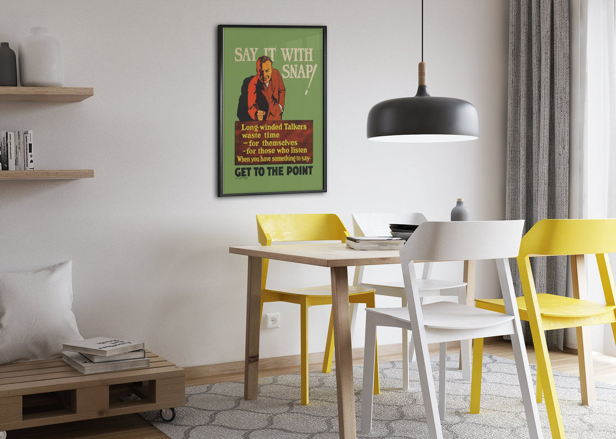 Say It With Snap poster framed above a dining table