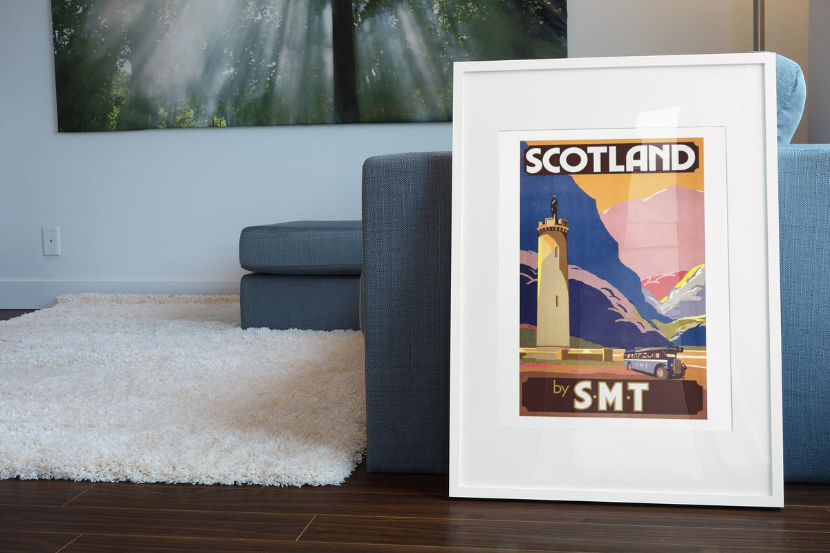 Scotland by SMT poster leaning beside a blue sofa