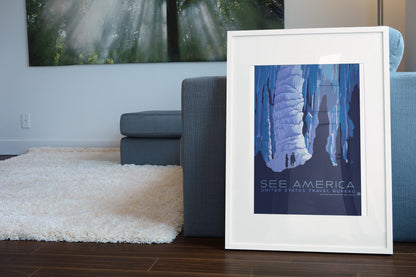 See America Caverns WPA poster leaning beside a blue sofa