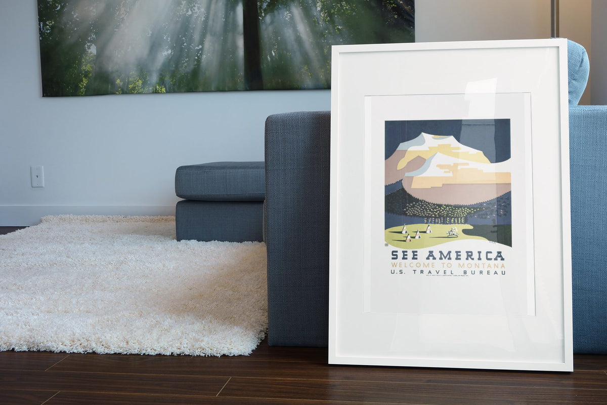 See America Montana WPA poster leaning beside a blue sofa