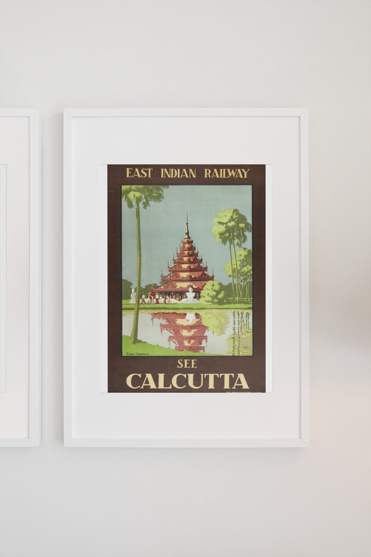 See Calcutta — East Indian Railway poster on a light wall