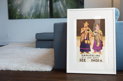 See India Darjeeling poster leaning beside a blue sofa