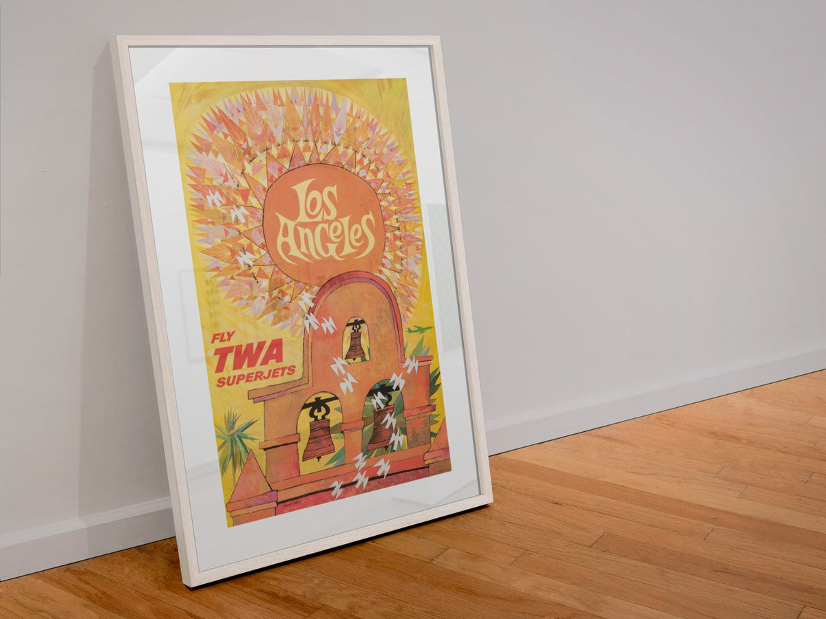See Los Angeles TWA poster in a white frame leaning against a wall