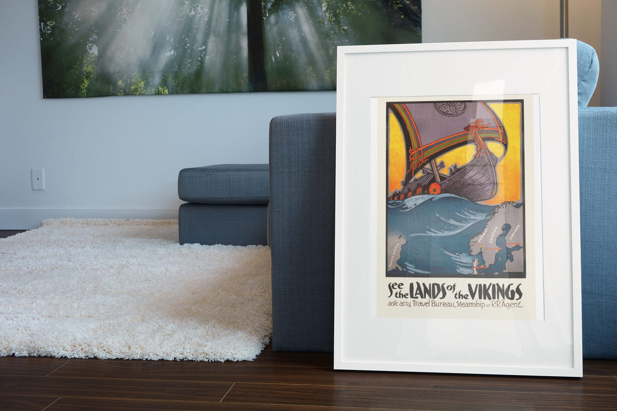 See the Lands of the Vikings poster leaning beside a blue sofa