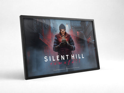 Silent Hill: Townfall Key Art poster in a black frame with glass leaning against a wall