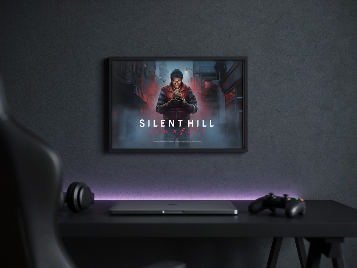 Silent Hill: Townfall Key Art poster in a black frame above a gaming desk
