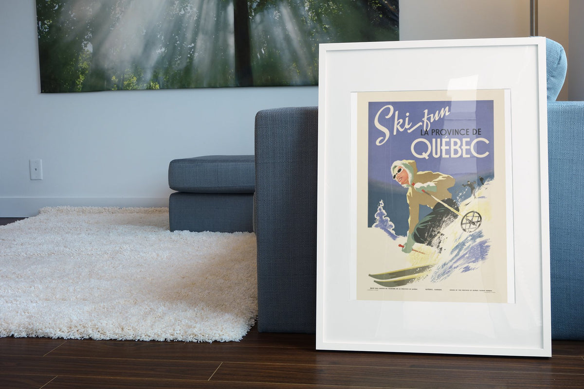 Ski Fun Quebec poster leaning beside a blue sofa