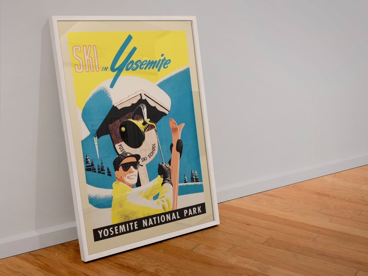 Ski in Yosemite poster in a white frame leaning against a wall
