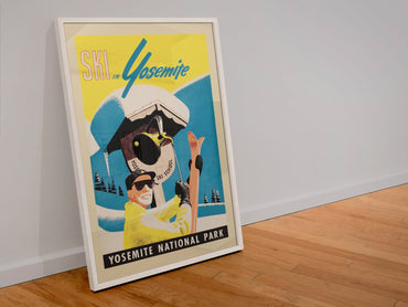 Ski in Yosemite poster in a white frame leaning against a wall
