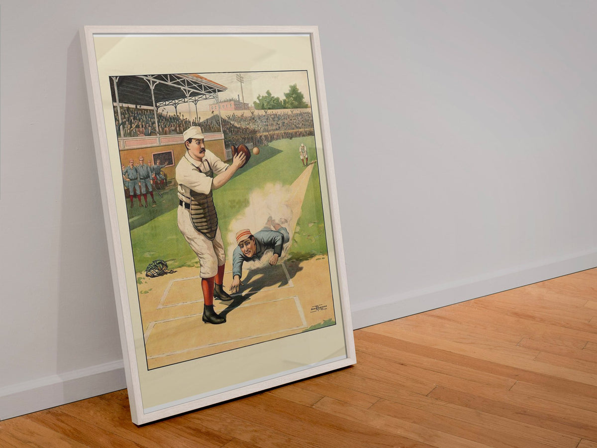 Baseball Home Plate Slide 1897 poster in a white frame leaning against a wall