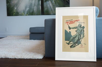 Soldier Dont Let This Happen poster leaning beside a blue sofa