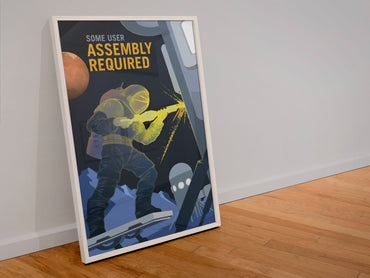 Some User Assembly Required poster in a white frame leaning against a wall