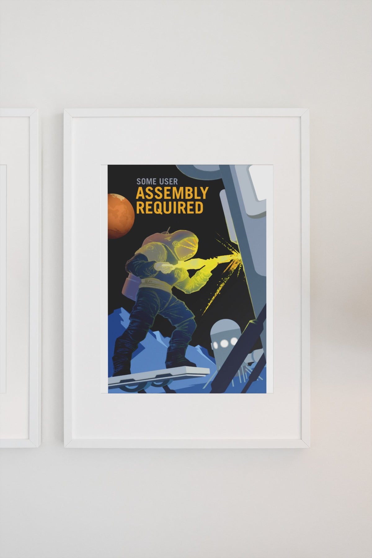 Some User Assembly Required poster in a white frame on a light wall