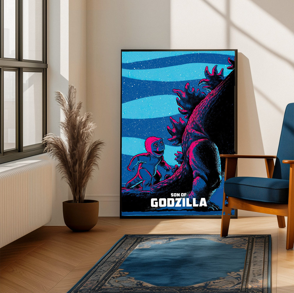 Son of Godzilla (1967) Movie Illustrated Art poster framed beside a blue armchair in a sunlit room