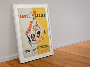 South Africa Union Castle poster in a white frame leaning against a wall