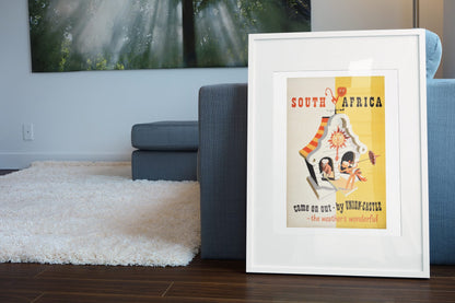 South Africa Union Castle poster leaning beside a blue sofa