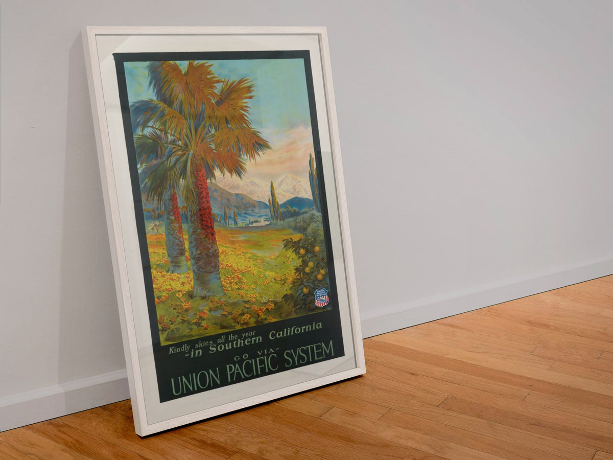Southern California Union Pacific poster in a white frame leaning against a wall