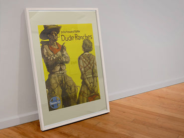 Southwestern Dude Ranches Santa Fe poster in a white frame leaning against a wall