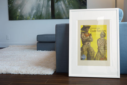 Southwestern Dude Ranches Santa Fe poster leaning beside a blue sofa
