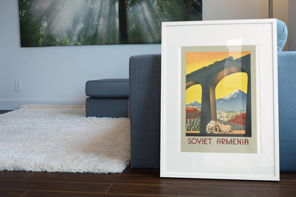Soviet Armenia poster leaning beside a blue sofa