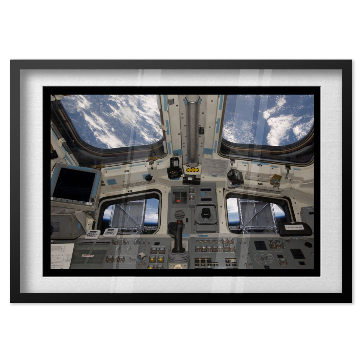 Space Shuttle Atlantis cockpit poster in a black frame