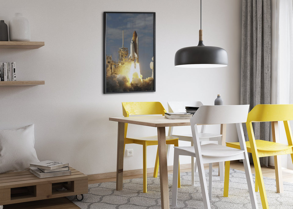 Space Shuttle Atlantis STS-122 launch poster framed above a dining table