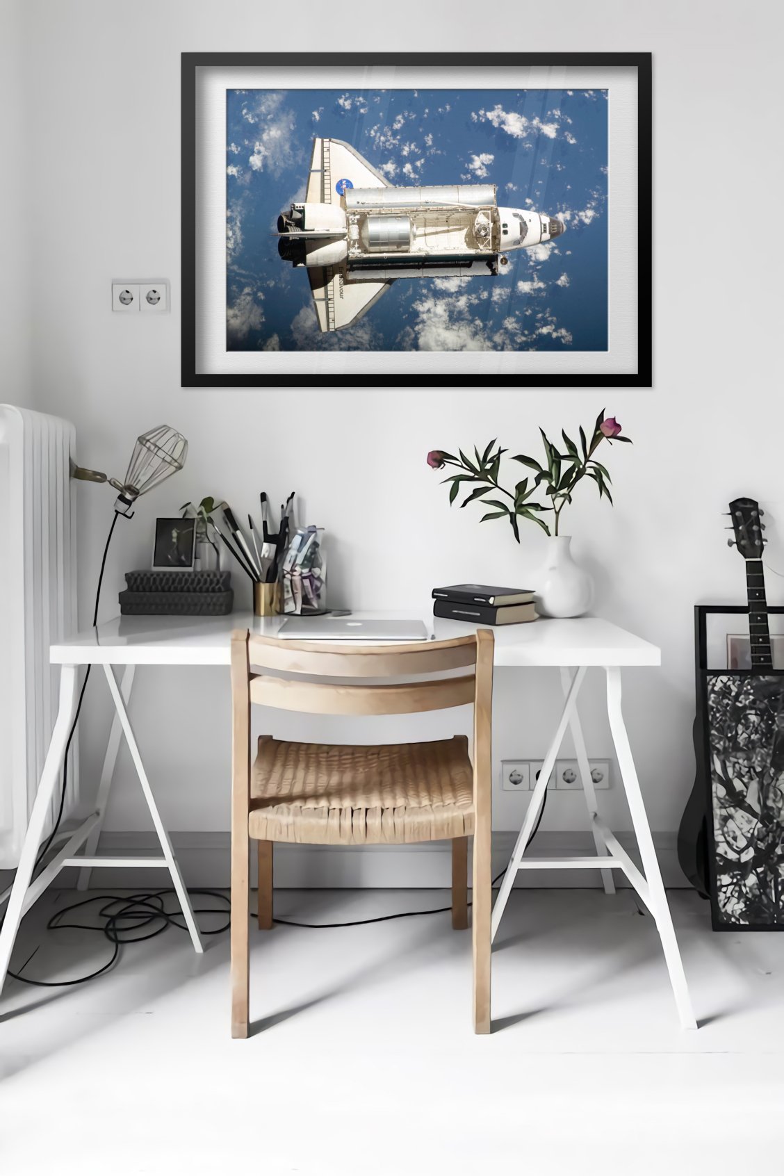 Space Shuttle Endeavour in orbit poster framed in a bright home office