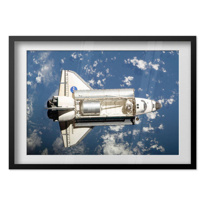 Space Shuttle Endeavour in orbit poster in a black frame
