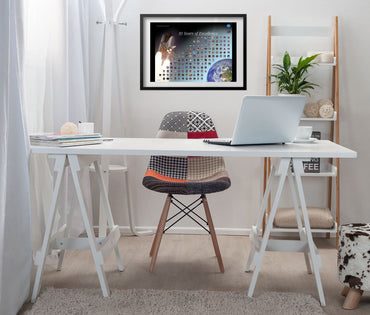 Space Shuttle mission patches, 30 Years of Excellence poster framed above a white desk