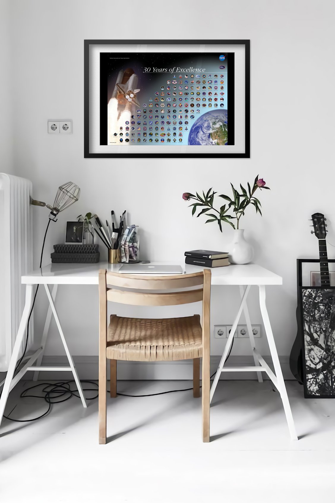Space Shuttle mission patches, 30 Years of Excellence poster framed in a bright home office