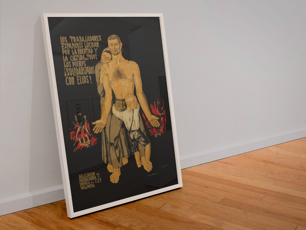Spanish Workers Fight! poster in a white frame leaning against a wall