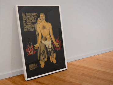Spanish Workers Fight! poster in a white frame leaning against a wall