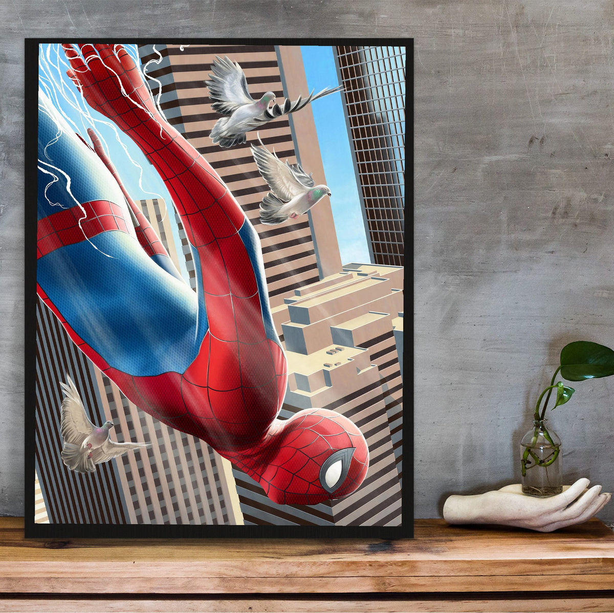 Spider-Man: Brand New Day (2026) Movie Skyscraper Dive Art poster in a black frame on a wooden shelf against concrete