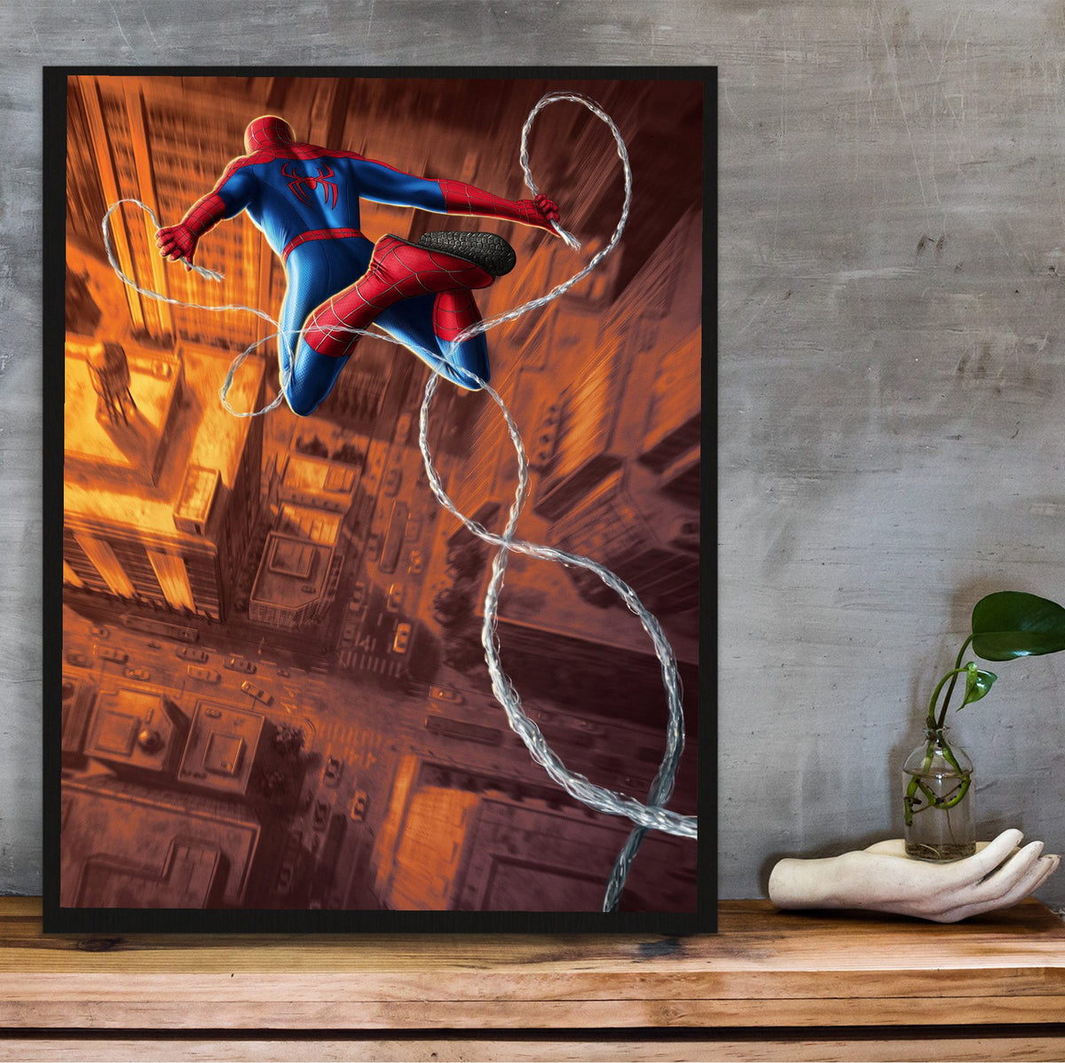 Spider-Man: Brand New Day (2026) Movie Web Swing Art poster in a black frame on a wooden shelf against concrete