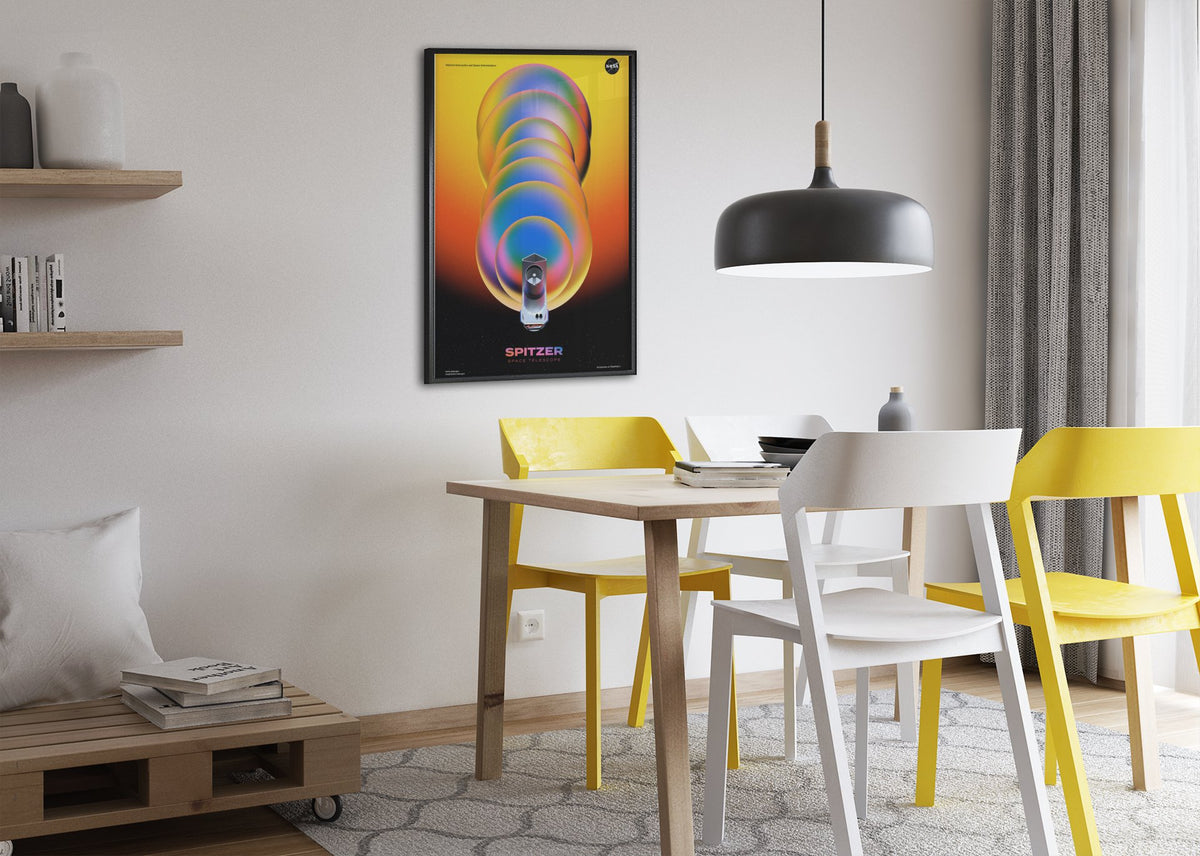 Spitzer Space Telescope poster framed above a dining table