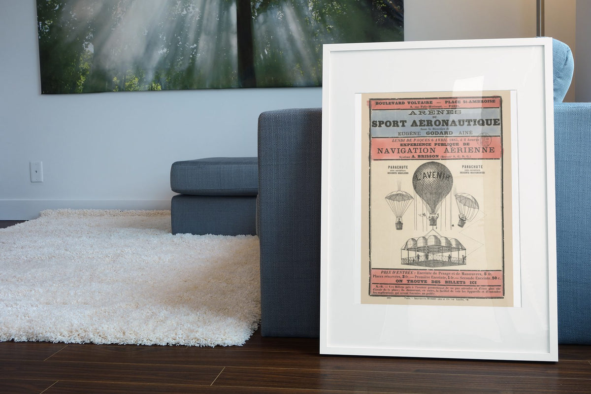Sport Aeronautique Hot Air Balloon poster leaning beside a blue sofa