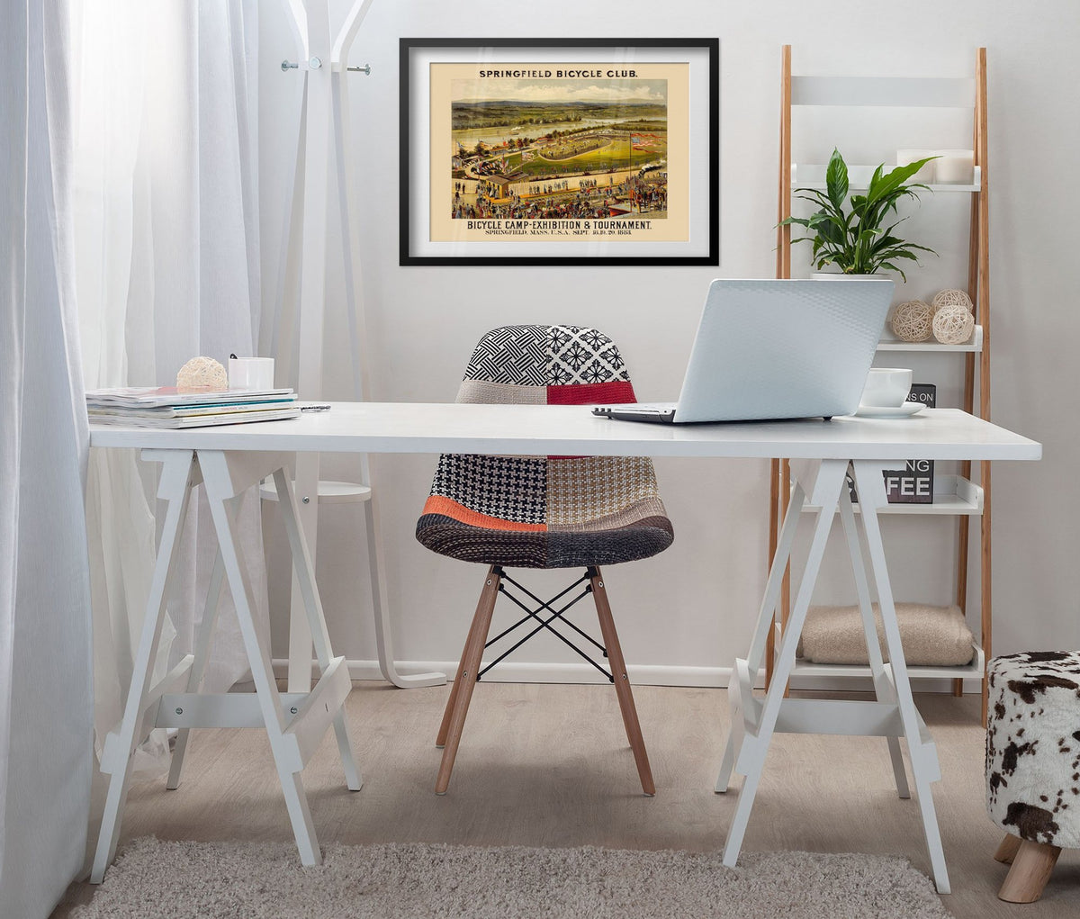 Springfield Bicycle Club 1883 poster framed above a white desk in a home office