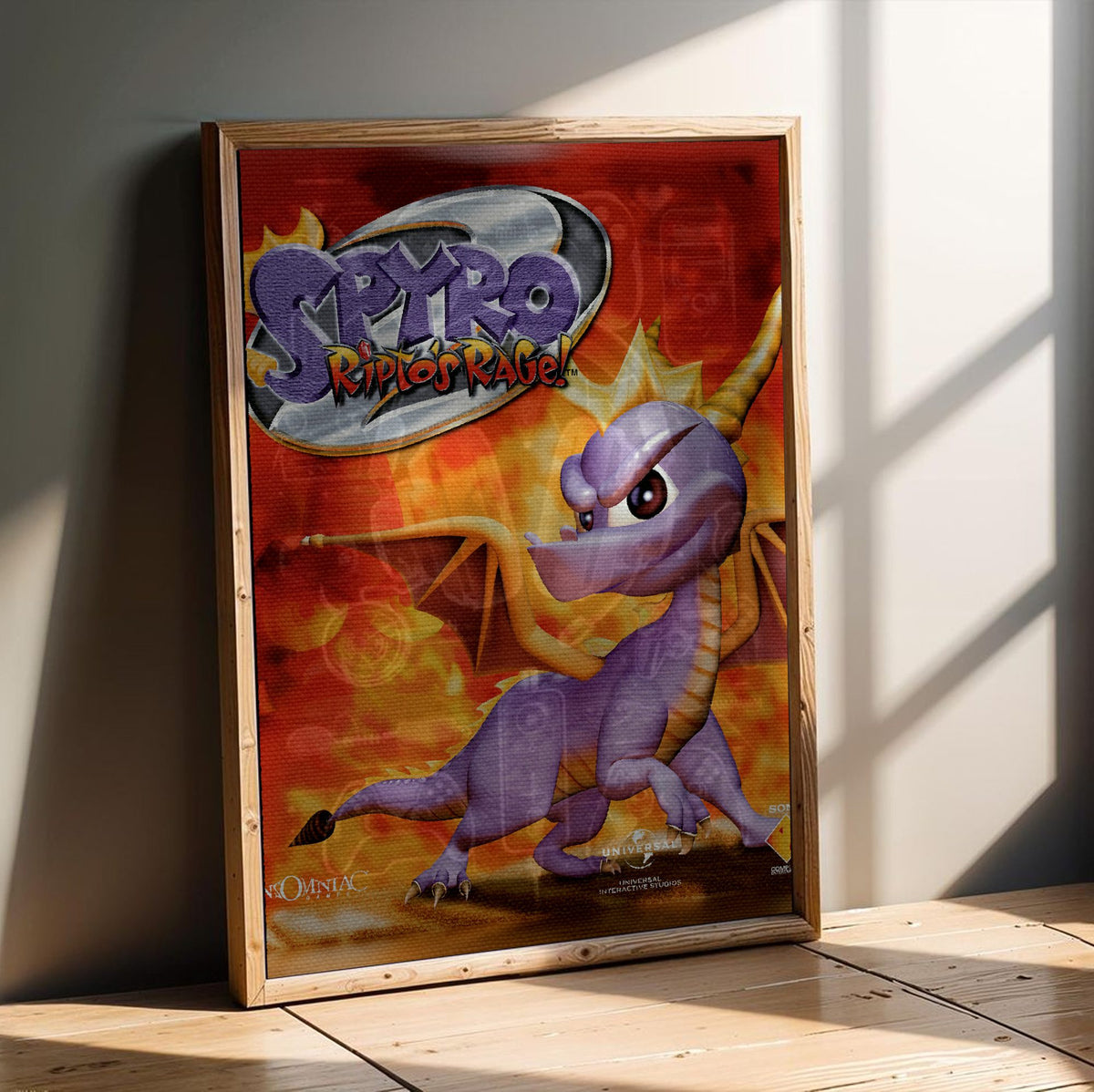 Spyro 2: Ripto's Rage! Box Art poster in an oak frame leaning on a wooden floor