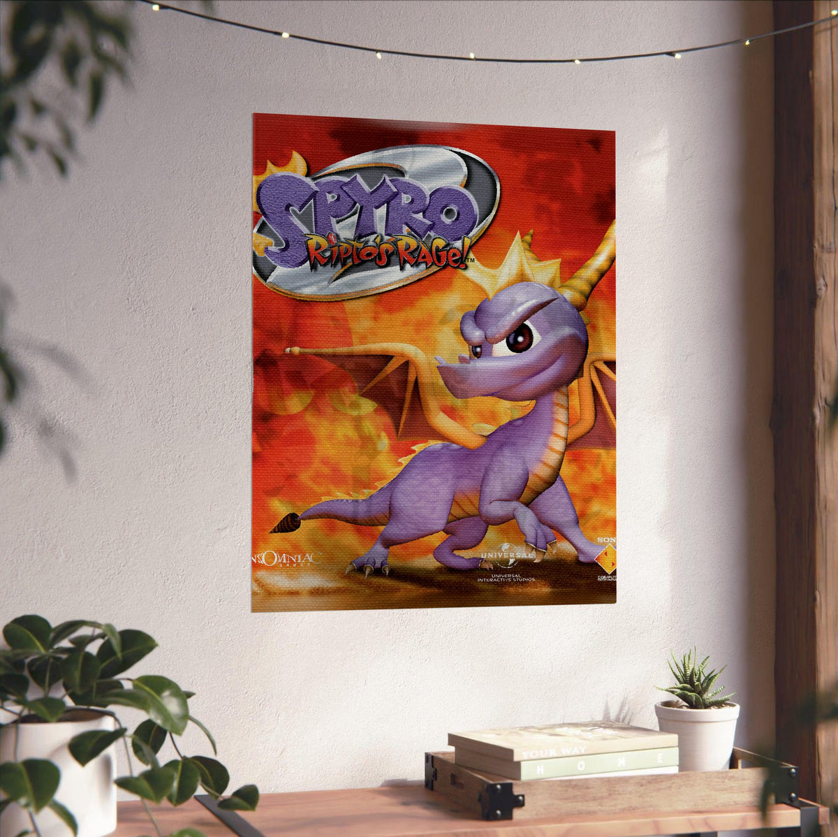 Spyro 2: Ripto's Rage! Box Art poster unframed on a white wall above a desk