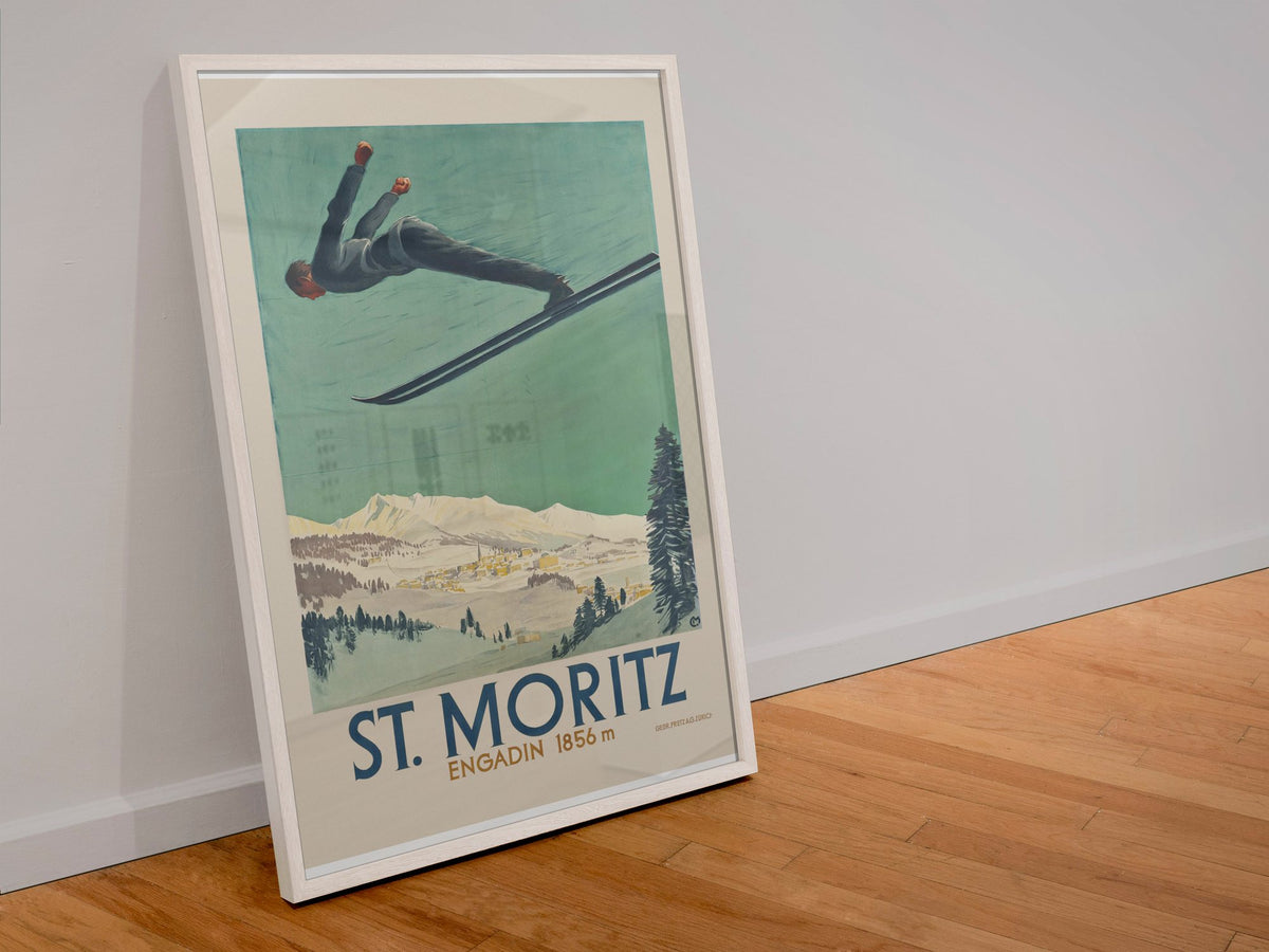 St. Moritz Engadin poster in a white frame leaning against a wall