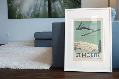 St. Moritz Engadin poster leaning beside a blue sofa