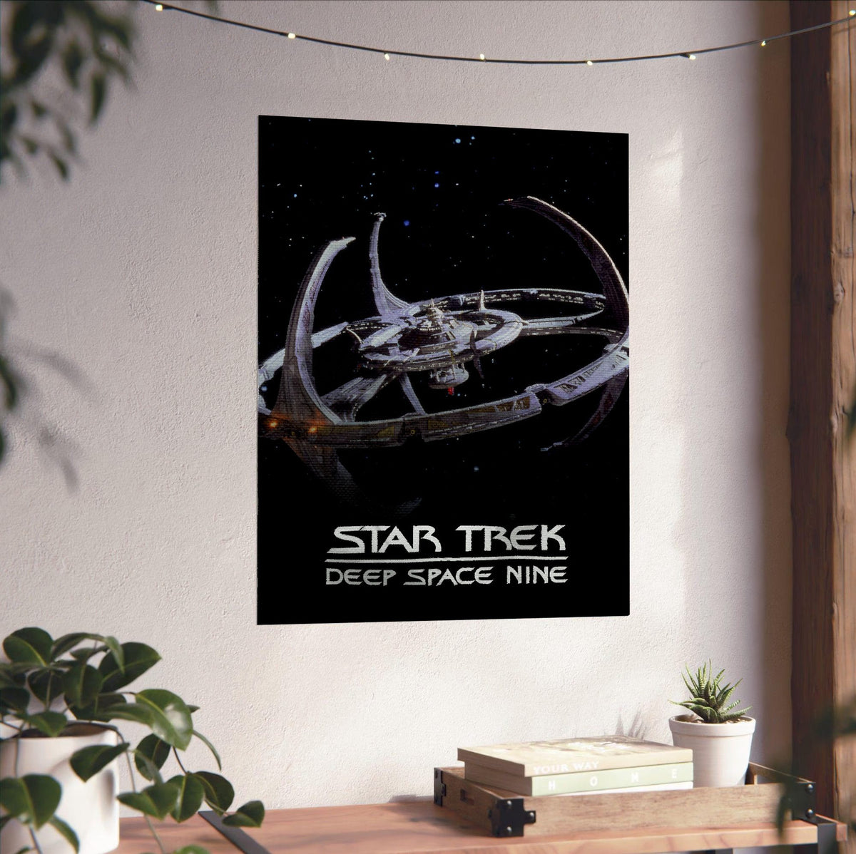 Star Trek: Deep Space Nine poster unframed on a white wall above a desk