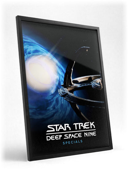 Star Trek: Deep Space Nine poster in a black frame with glass leaning against a wall