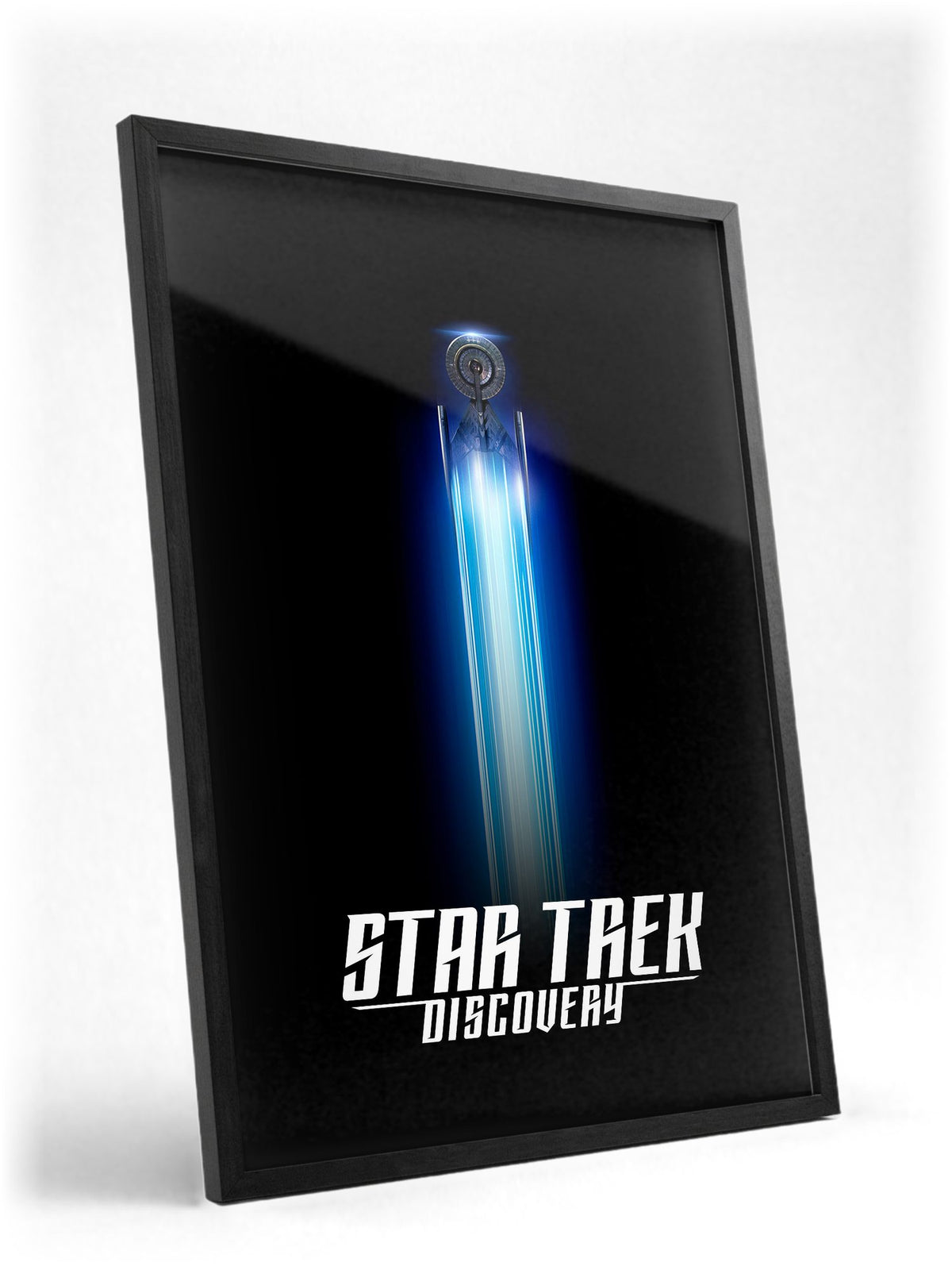 Star Trek: Discovery poster in a black frame with glass leaning against a wall