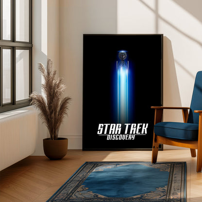 Star Trek: Discovery poster framed beside a blue armchair in a sunlit room