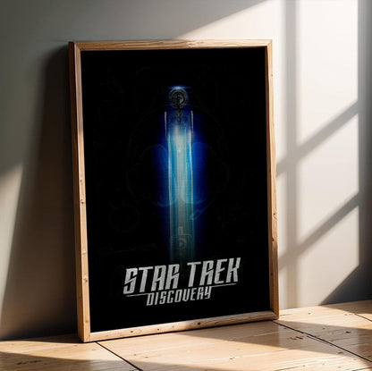Star Trek: Discovery poster in an oak frame leaning on a wooden floor