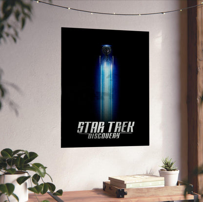 Star Trek: Discovery poster unframed on a white wall above a desk