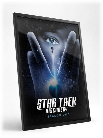 Star Trek: Discovery poster in a black frame with glass leaning against a wall