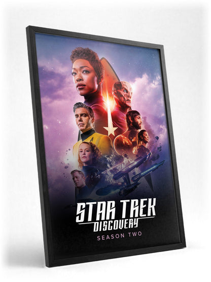Star Trek: Discovery poster in a black frame with glass leaning against a wall